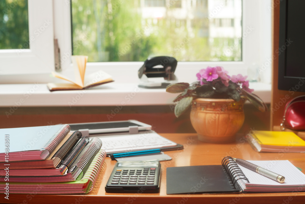 Office desk table with computer, supplies, flower. Copy space for text Office desk table with computer, supplies, flower. Copy space for text