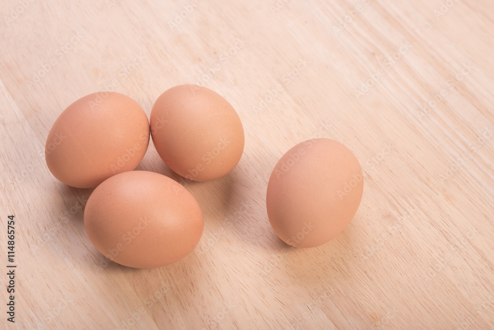 Fresh eggs ingredient on a wooden table rustic background. Fresh eggs ingredient on a wooden table rustic background.
