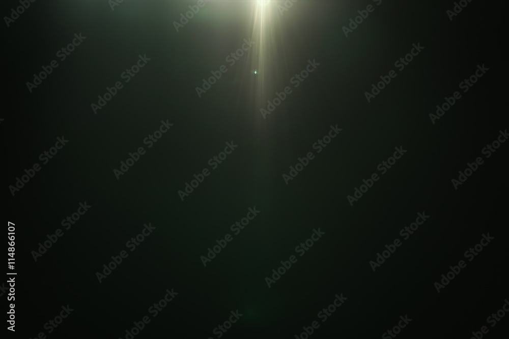 real green lens flare over dark background real green lens flare over dark background