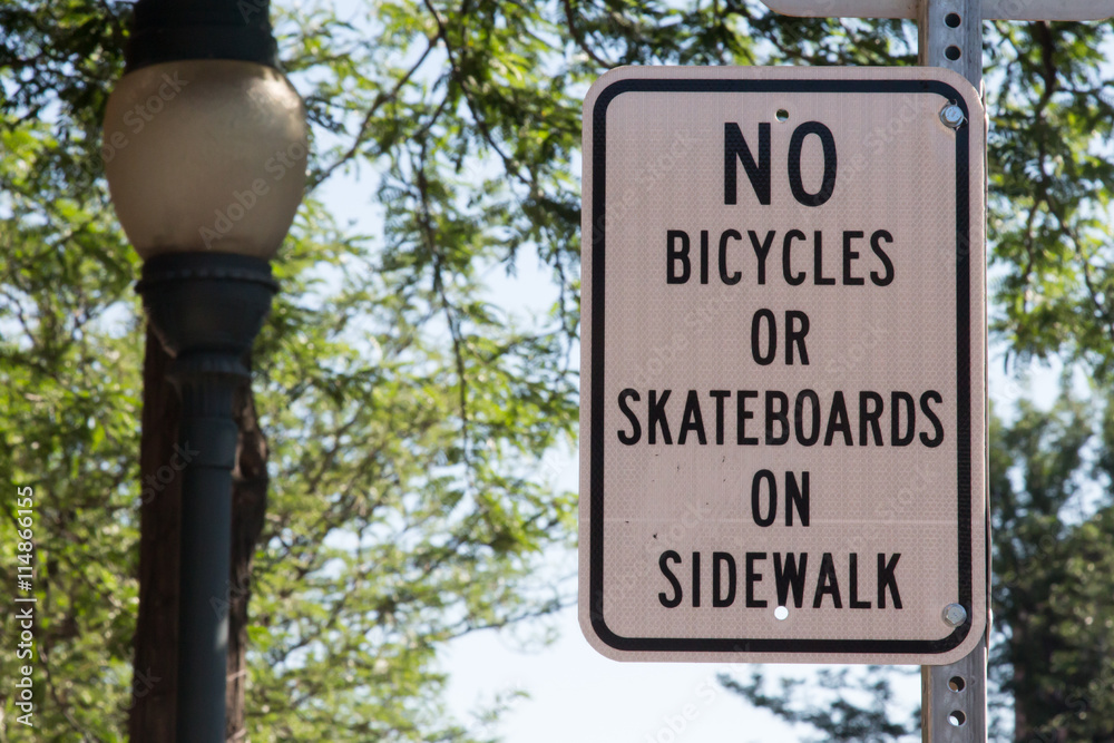 No bicycles or skateboards on sidewalk sign