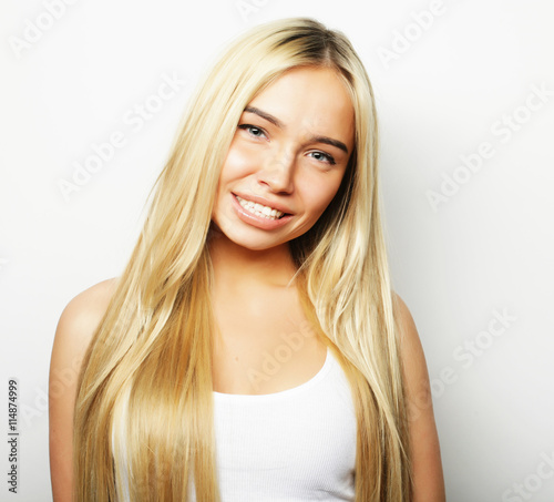 Young cute smiling blond girl