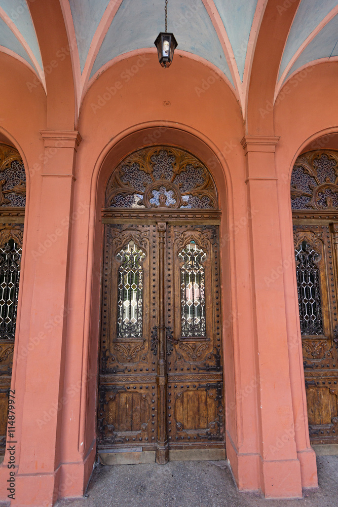 Old wooden door of the Christian church. Architecture