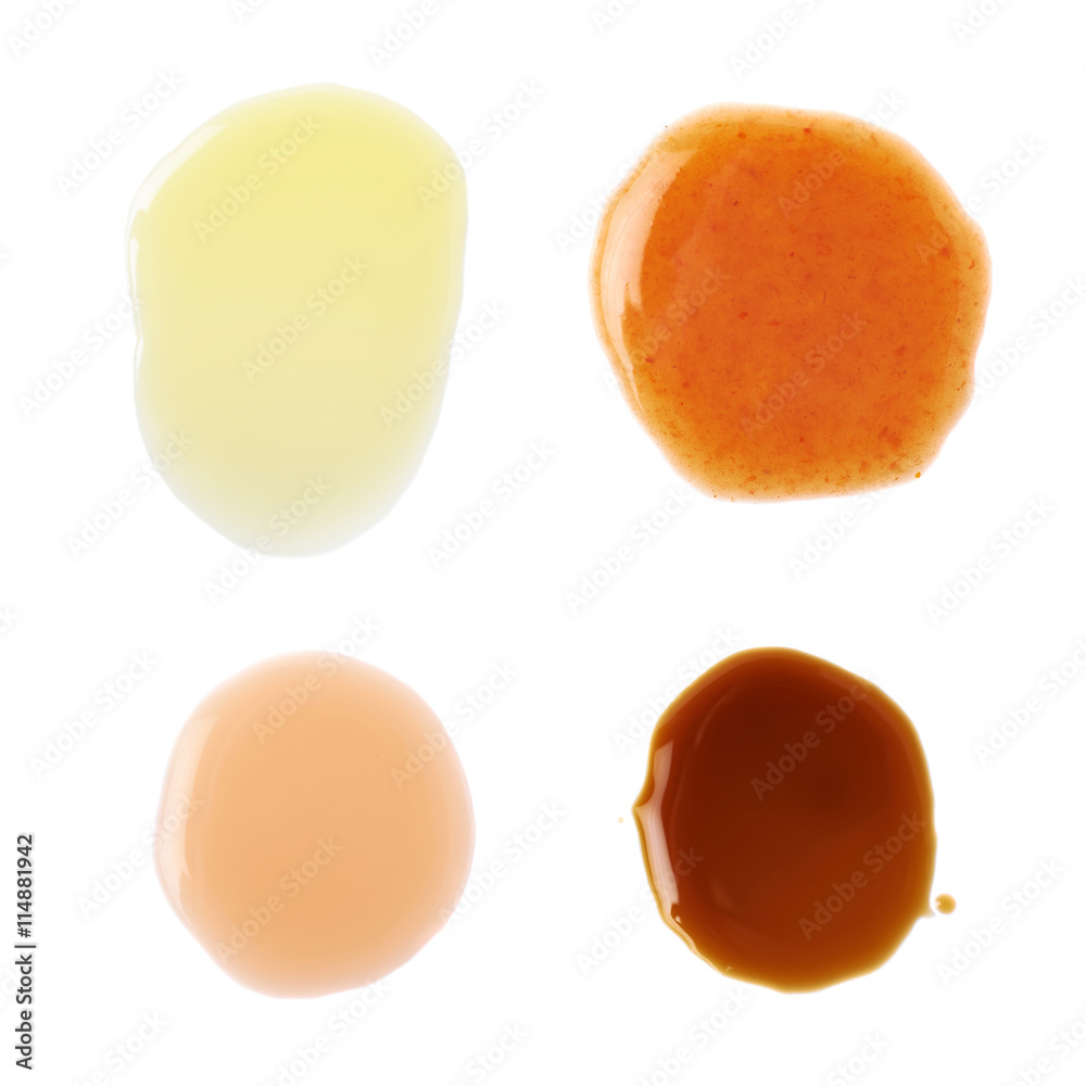 Four puddles of sauce isolated
