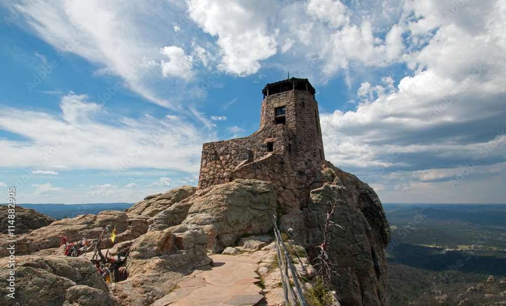 Harney Peak Fire Lookout Tower on a sunny cloudy day in Custer State Park in the Black Hills of South Dakota USA