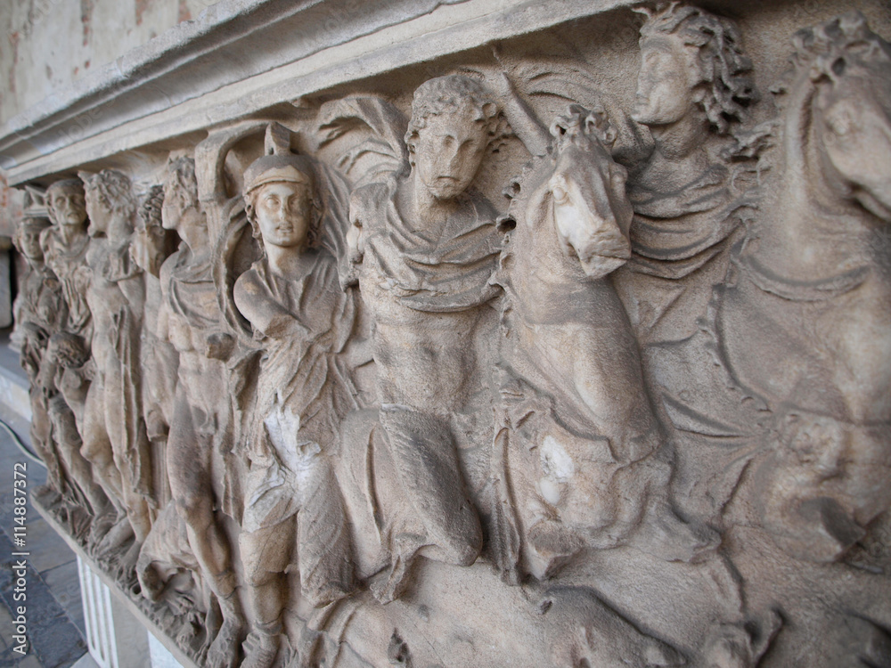 high relief of horseman on tombstone in Pisa