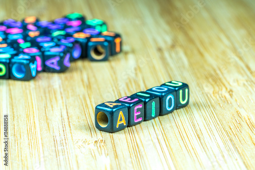 Colorful letter cube with bamboo texture surface. Educational co photo