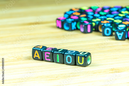 Colorful letter cube with bamboo texture surface. Educational co photo