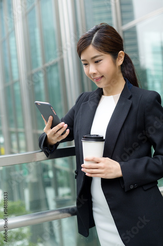 Business woman use of mobile phone © leungchopan