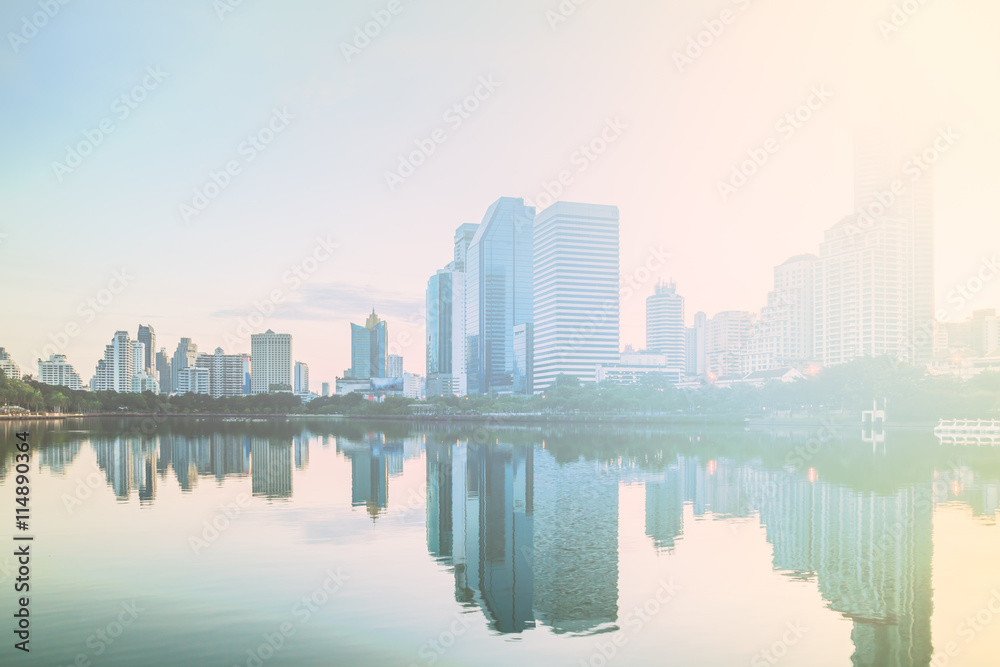 Bangkok city sunrise reflection river of sun. Panoramic view light blue background of glass high rise building skyscraper commercial of future. Business concept of success industry tech architecture
