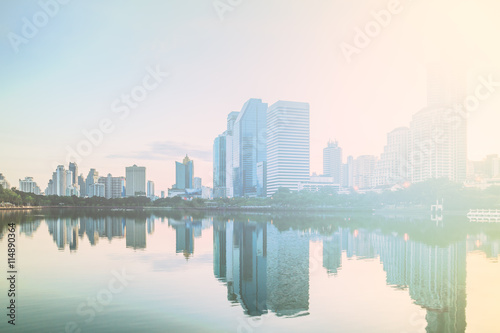 Bangkok city sunrise reflection river of sun. Panoramic view light blue background of glass high rise building skyscraper commercial of future. Business concept of success industry tech architecture © Me studio