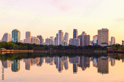 Bangkok city sunrise reflection river of sun. Panoramic view light blue background of glass high rise building skyscraper commercial of future. Business concept of success industry tech architecture © Me studio