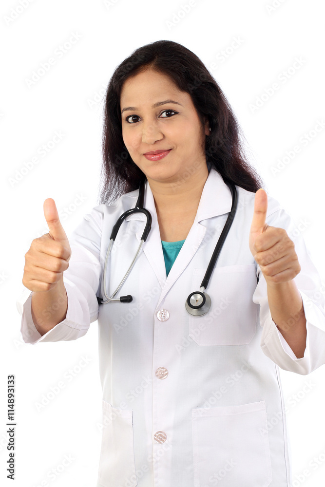 Young female doctor with thumbs up gesture Young female doctor with thumbs up gesture