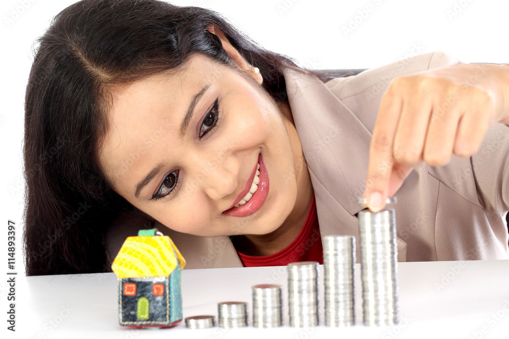 Young business woman arranging stack of coins - Money growth con Young business woman arranging stack of coins - Money growth con