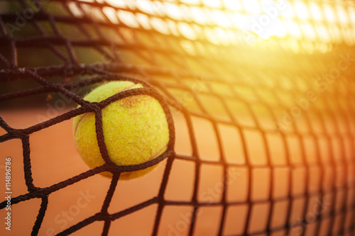 Tennis ball and net © yossarian6