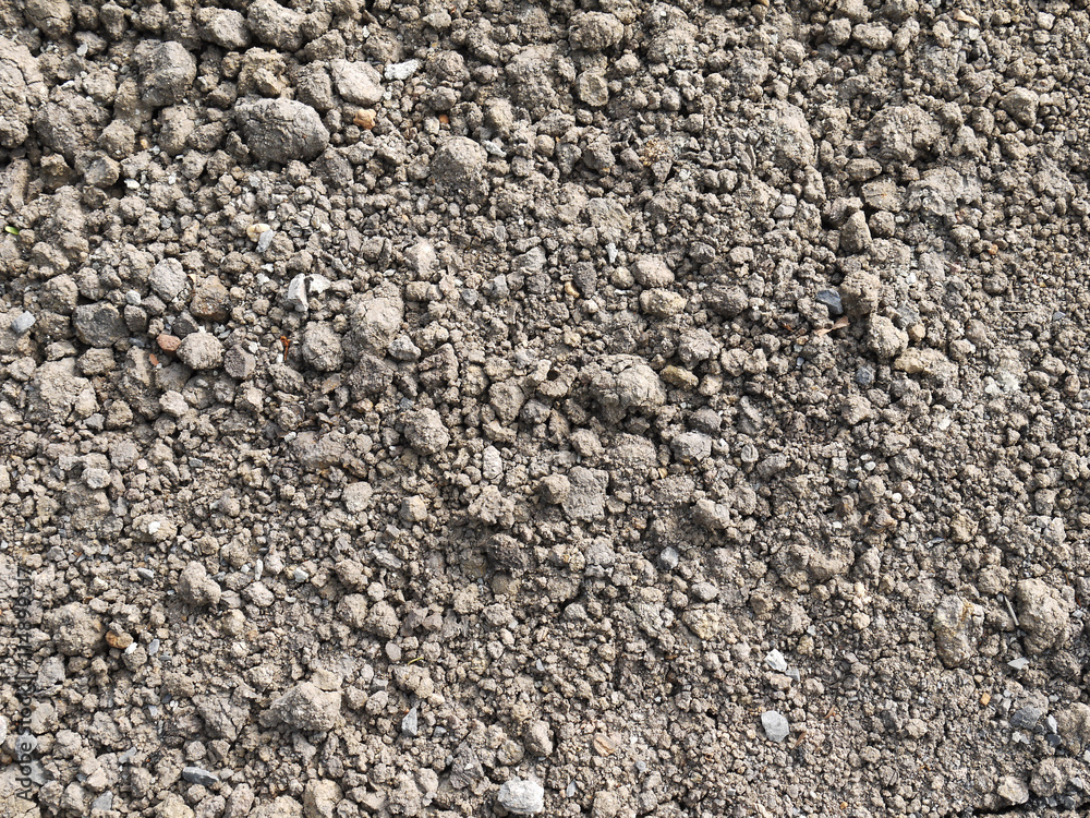 Ground textured surface background under bright sunlight Ground textured surface background under bright sunlight