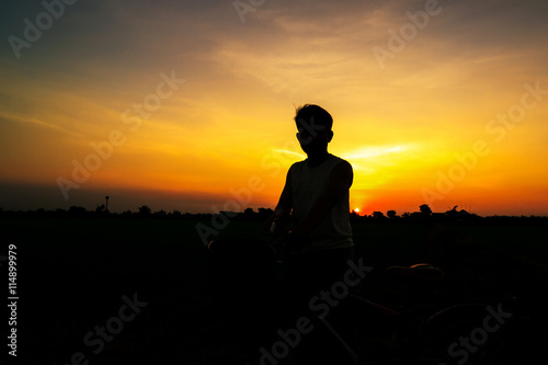 Cyclist silhouette in sunset