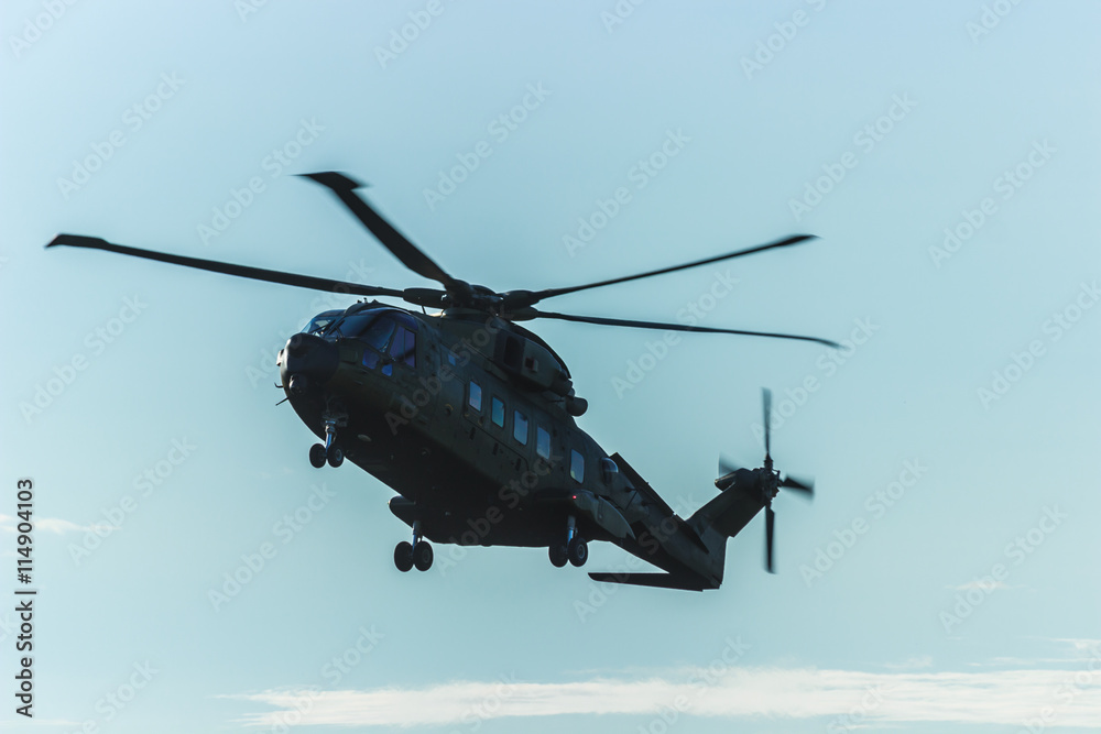 Military helicopter in the sky,close up of a military helicopter in flight