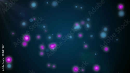 Animation of moving glowing spheres on a dark background photo