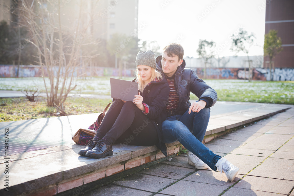 young couple lovers authentic using tablet