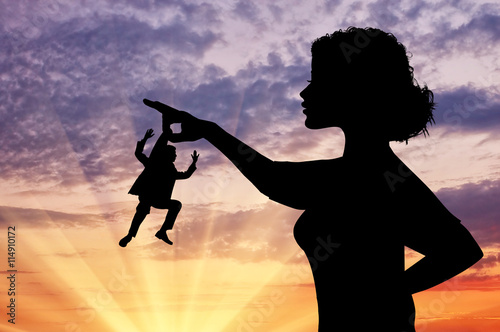 Silhouette feminist holding a small man. photo