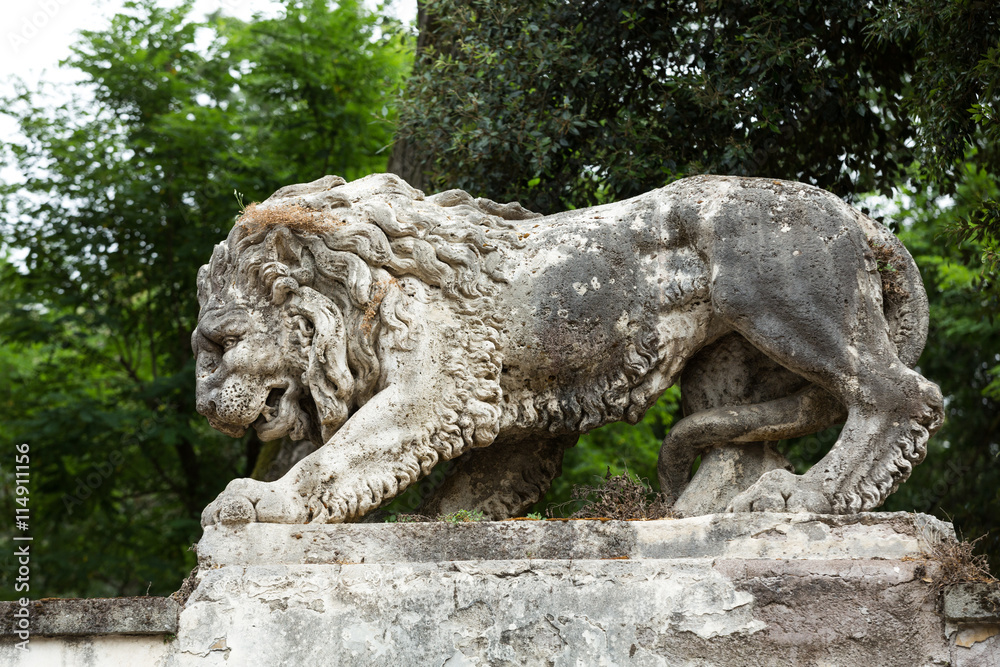 Lion sculpture in Garden of Villa Borghese. Rome, Ital