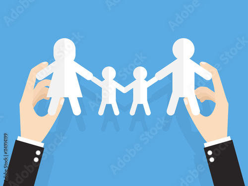 hands of businessman or manager holding family cut out paper