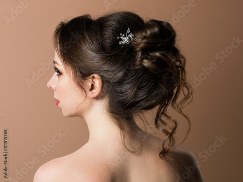 Beautiful sensual brunette with elegant hairstyle.Beauty wedding