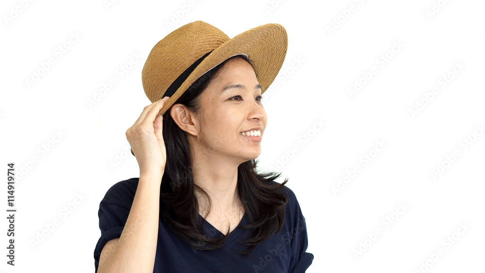 Casual friendly asian girl wearing hat relaxing and smiling on isolated background
