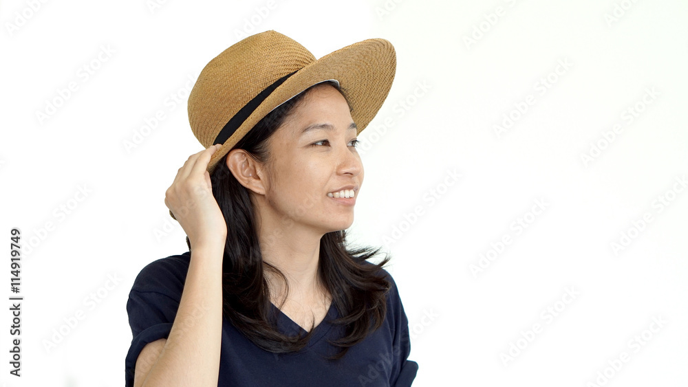 Casual friendly asian girl wearing hat relaxing and smiling on isolated background Casual friendly asian girl wearing hat relaxing and smiling on isolated background