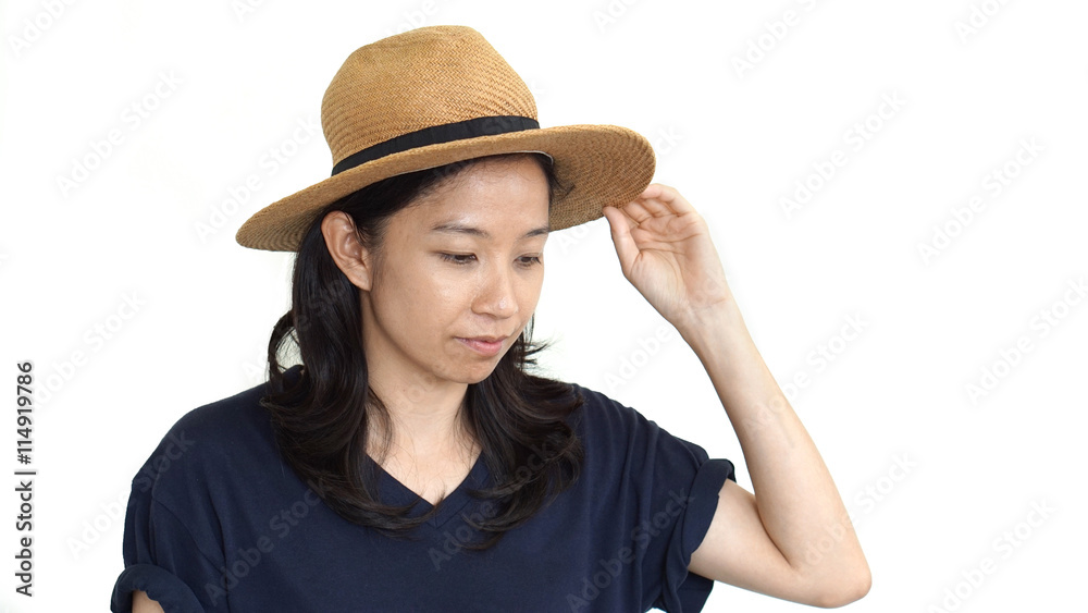 Casual friendly asian girl wearing hat relaxing and smiling on isolated background Casual friendly asian girl wearing hat relaxing and smiling on isolated background