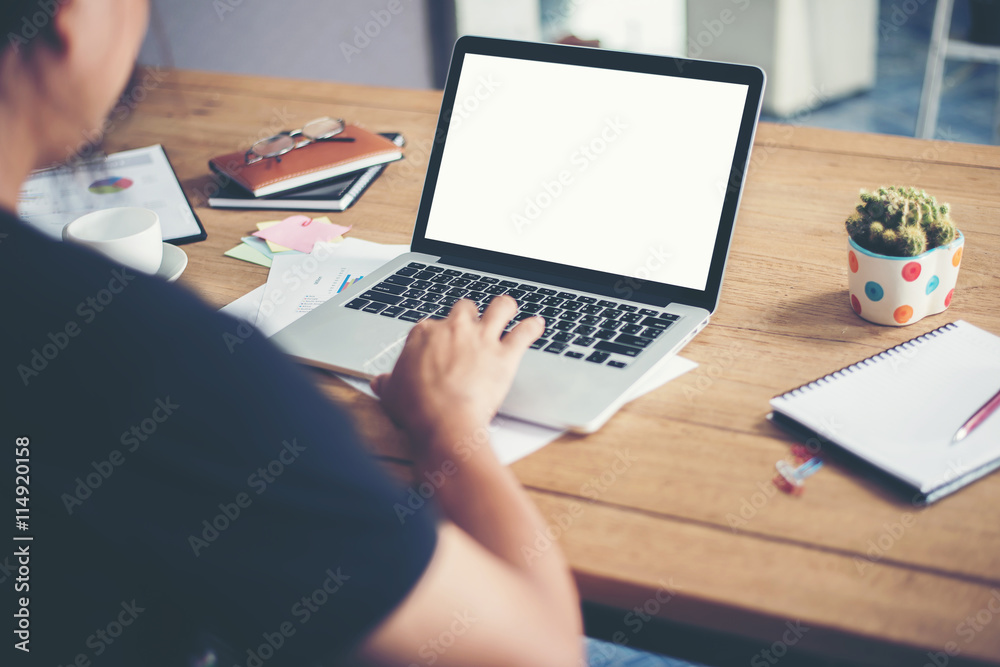 man hands typing working with laptop on wooden desk. man hands typing working with laptop on wooden desk.