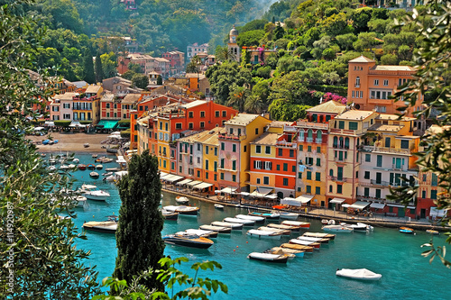 Portofino with boats and yacht in little bay harbor. Liguria, Italy