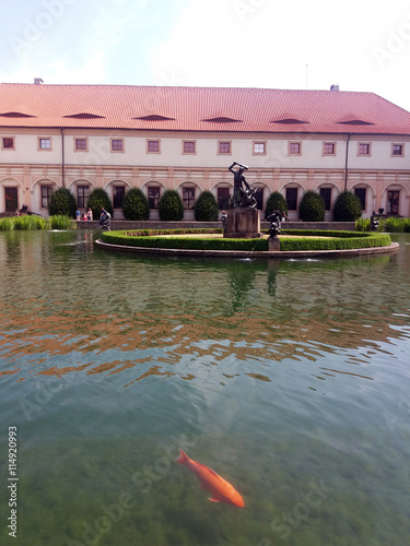 Palace with fountain and red fish photo