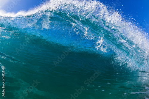 Wave swimming inside ocean blue water closeup photo