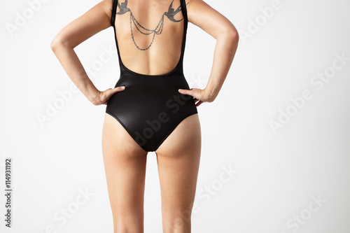 perfect fit woman from the back with tattoed back