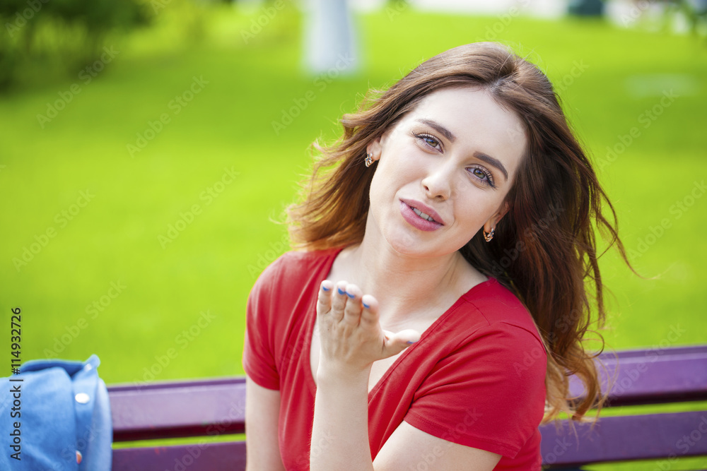 Blow kiss, young caucasian female haired model Blow kiss, young caucasian female haired model