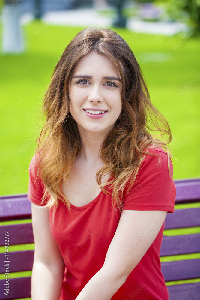 Beautiful young brunette girl in a red dress Beautiful young brunette girl in a red dress