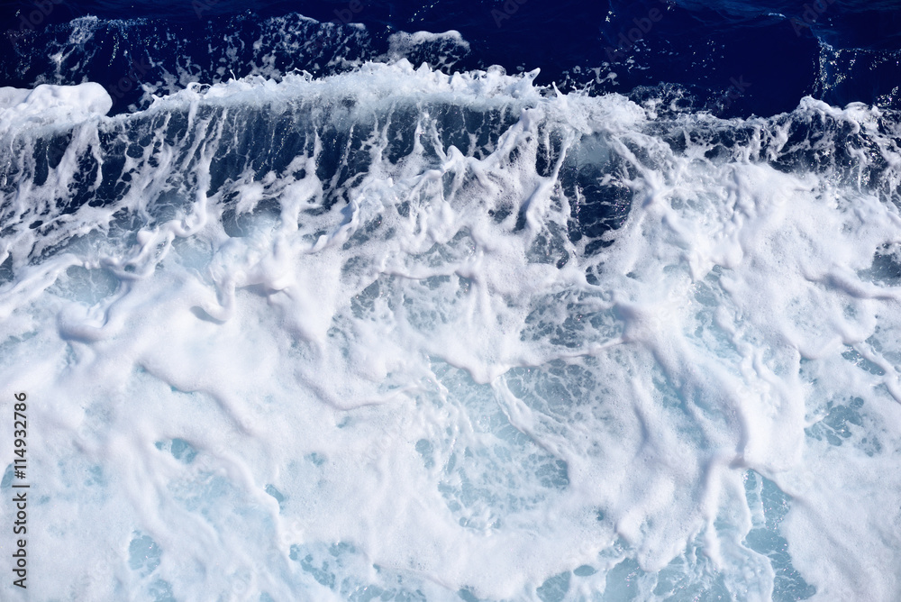 Restless foamy blue sea water from above Restless foamy blue sea water from above