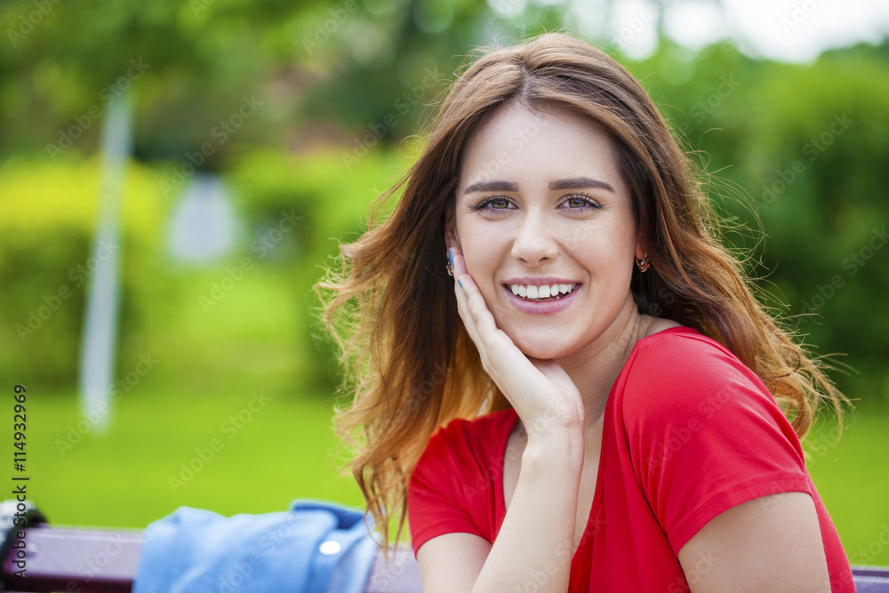 Beautiful young brunette girl in a red dress Beautiful young brunette girl in a red dress