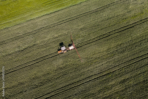 aerial view of the tractor on harvest field