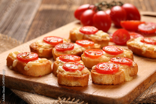 Grilled toast with cheese and tomatoes