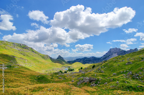 Montenegro, national park Durmitor, mountains and clouds. Sunlight lanscape.