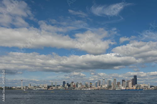 Seattle Skyline. A summertime view of the Seattle skyline looking from west Seattle across Elliott Bay. Cruise ships, ferryboats, tugboats, and freighters are a common sight in this maritime city. © LoweStock