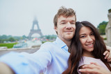 Romantic couple taking selfie in Paris