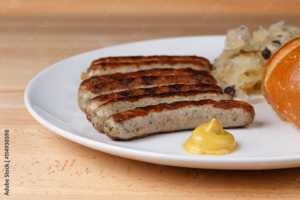 Authentic sausages from Nuremberg Bavaria with Sauerkraut and Roll