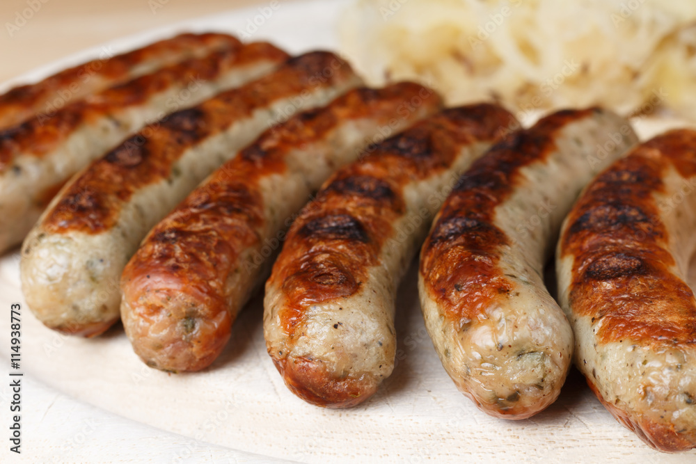 Authentic sausages from Nuremberg Bavaria with Sauerkraut and Roll Authentic sausages from Nuremberg Bavaria with Sauerkraut and Roll