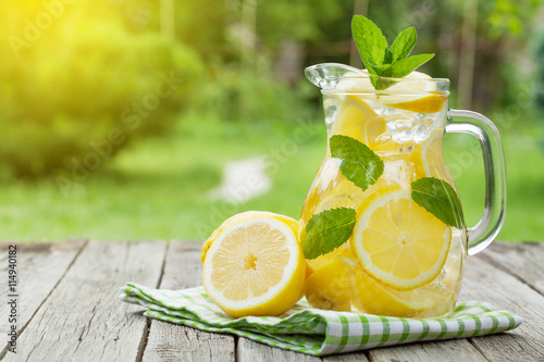 Fototapeta Lemonade with lemon, mint and ice