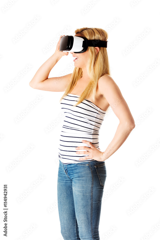 Girl wearing virtual reality goggles isolated on white. Girl wearing virtual reality goggles isolated on white.