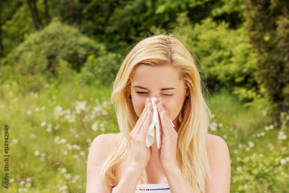Girl with alergy blowing her nose. Girl with alergy blowing her nose.
