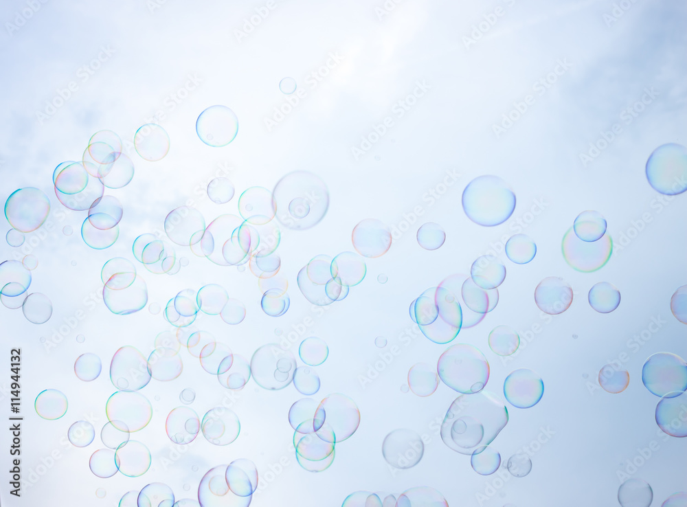 Soap bubbles on sky background